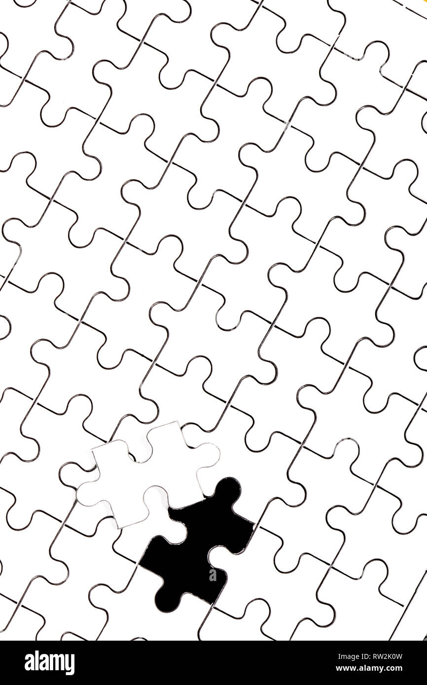 white jigsaw puzzle with one piece apart Stock Photo Alamy