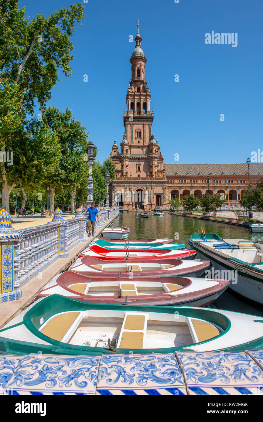 Boats for tourists docked on the canal in Plaza de Espa–a -Seville , Spain Stock Photo