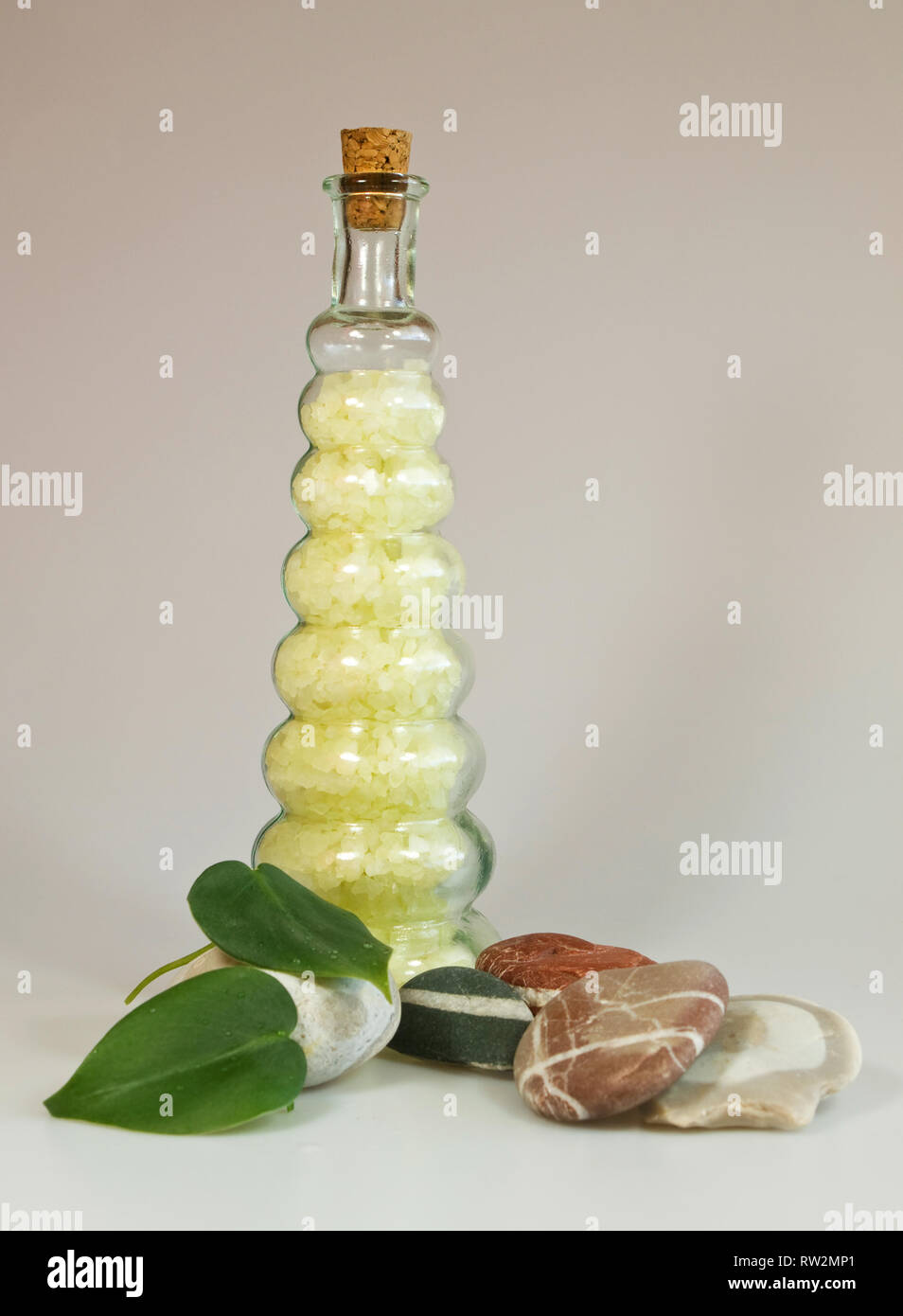 Bath salts with stones and leaves Stock Photo