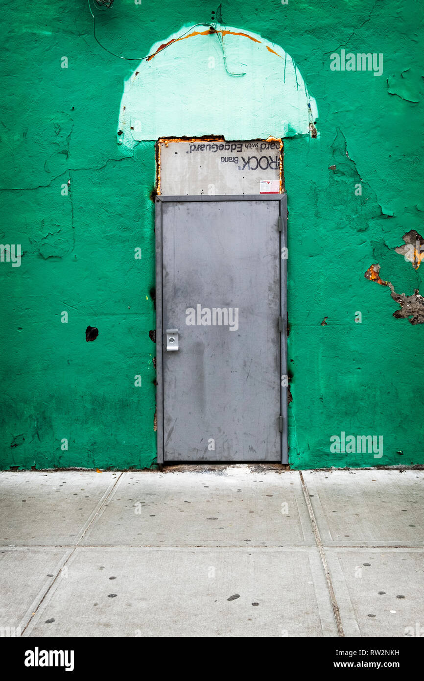 A Mysterious Rundown Closed Door On A Side Street In Corona