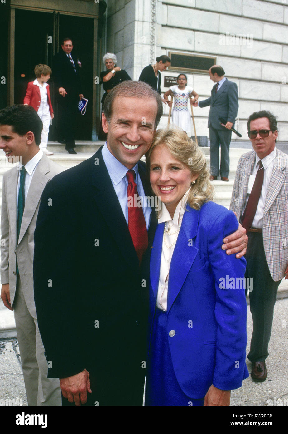 Washington, DC. USA, June 9, 1987  Senator Joe Biden after announcing his candidacy for president in Wilmington, Delaware earlier in the morning, and taking the train to Washington DC. makes an appearance with his wife Doctor Jill Biden outside the Dirksen Senate office building. Credit: Mark Reinstein / MediaPunch Stock Photo