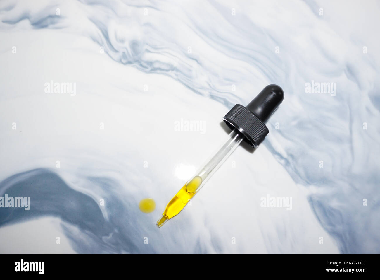 Glass dropper with essential oil Stock Photo Alamy