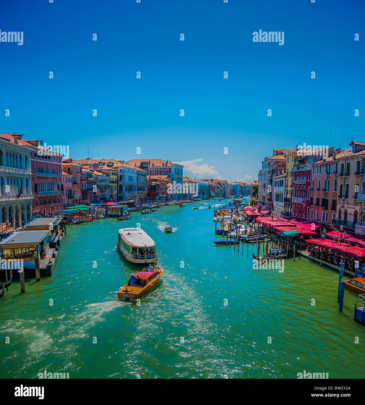 Venice Canal view with gondolas, boats, canal houses Stock Photo Alamy