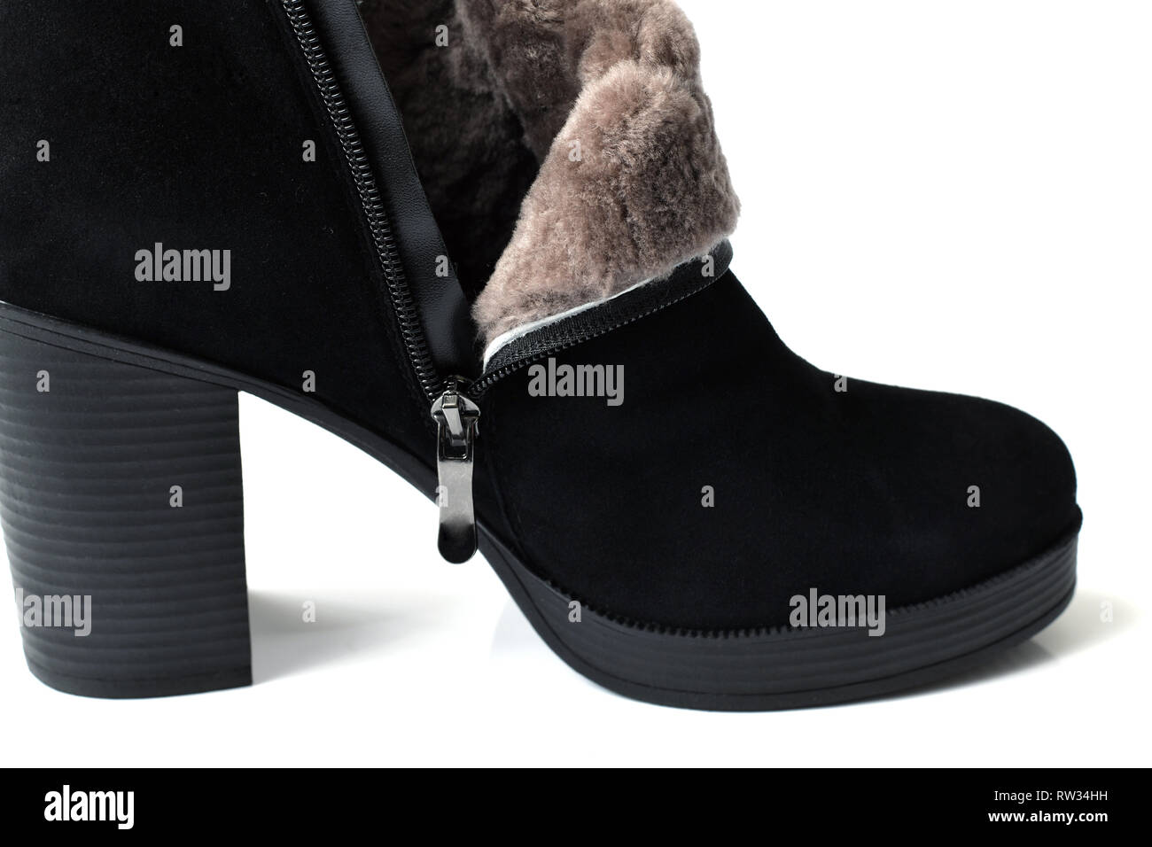 Black womens ankle boots with natural fur Stock Photo