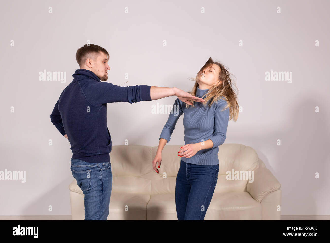 people, violence and abuse concept angry man hitting woman in her