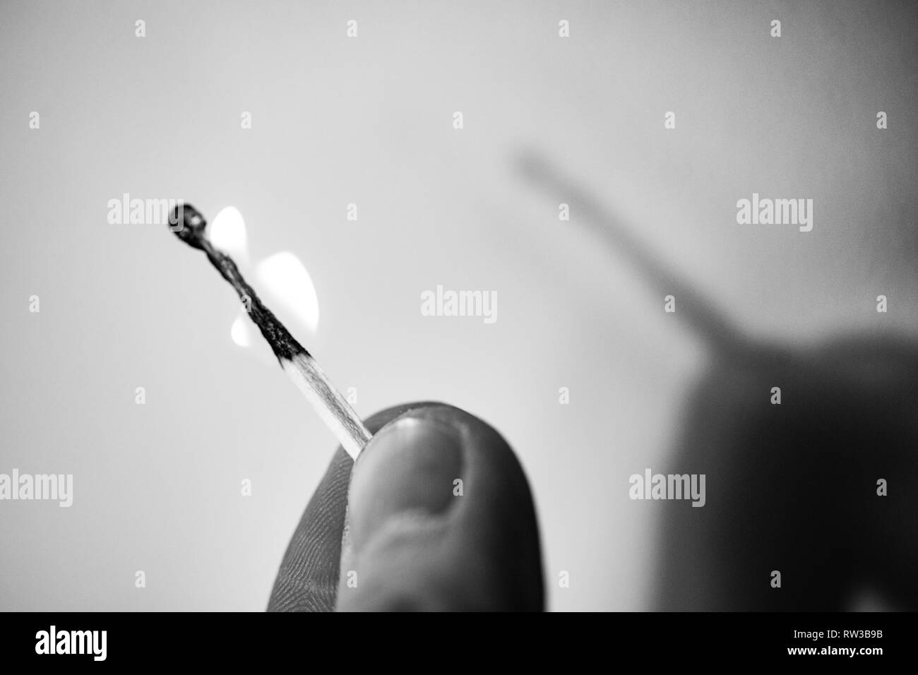 Fire match not throwing a shadow. Play of light and shade Experiment