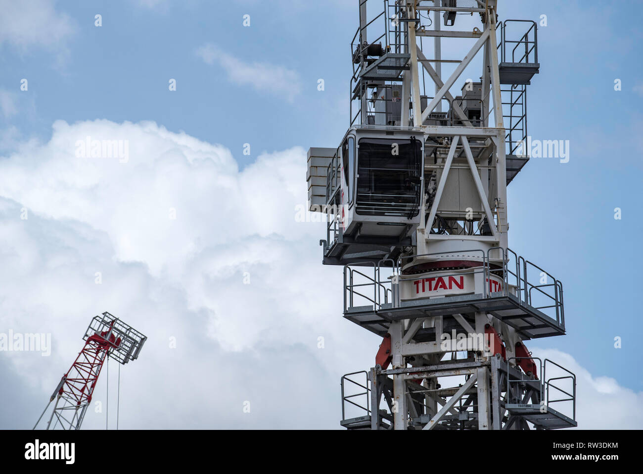 Heavy weight high level luffing construction cranes on a work site in