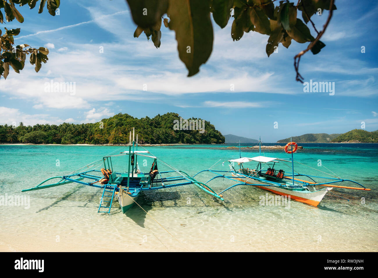 Small bangka boats on beach of Paradise island, Port Barton, Philippines Stock Photo