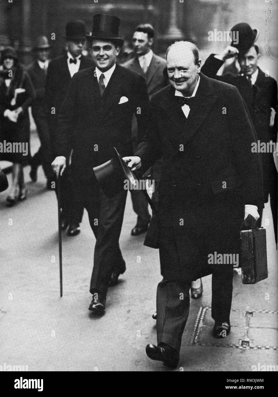 Winston Churchill with his Parliamentary  Private Secretary, Robert Boothby,on his way to delivering his fourth budget, 24th April 1928 Stock Photo