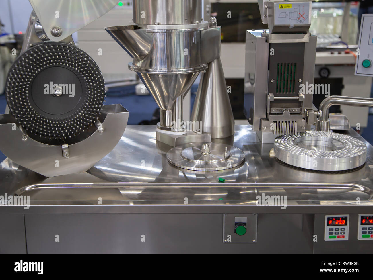 Capsule filling machine in pharmaceutical industrial Stock Photo Alamy
