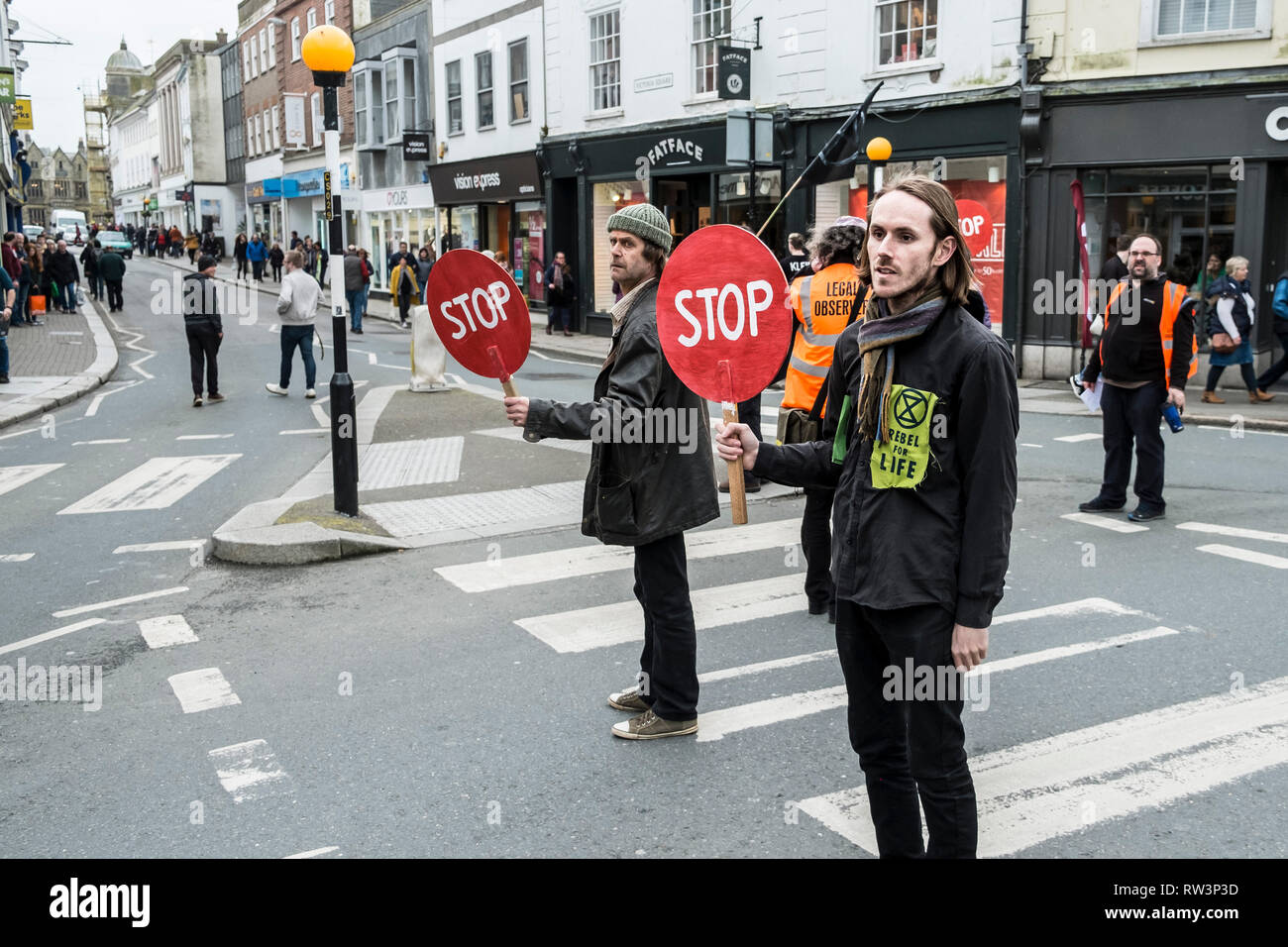 Protesters from Extinction Rebellion stopping traffic during a demonstration about the ecological crisis. Stock Photo