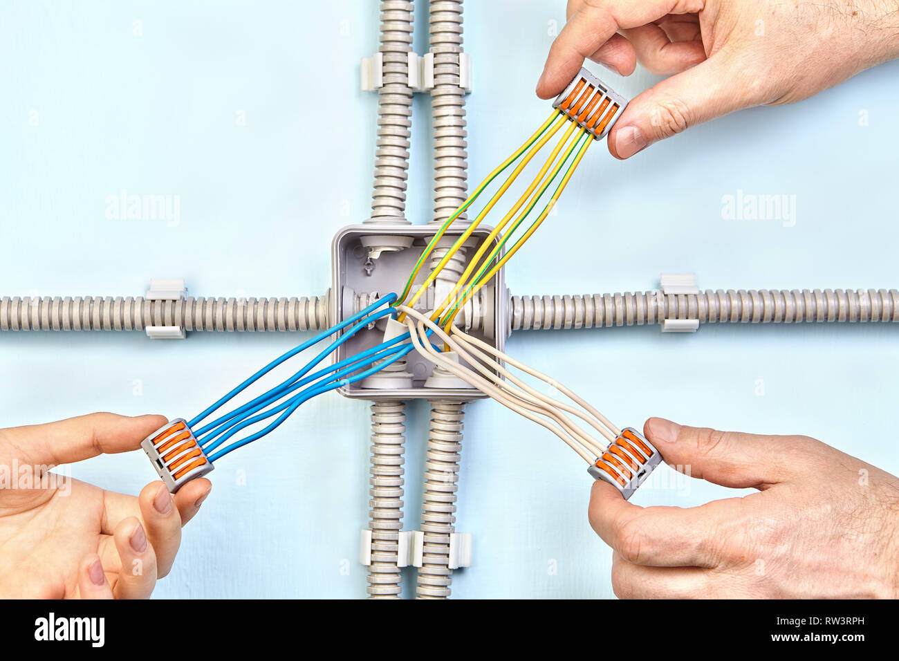 Jack of all trades is installing plastic junction box designed for