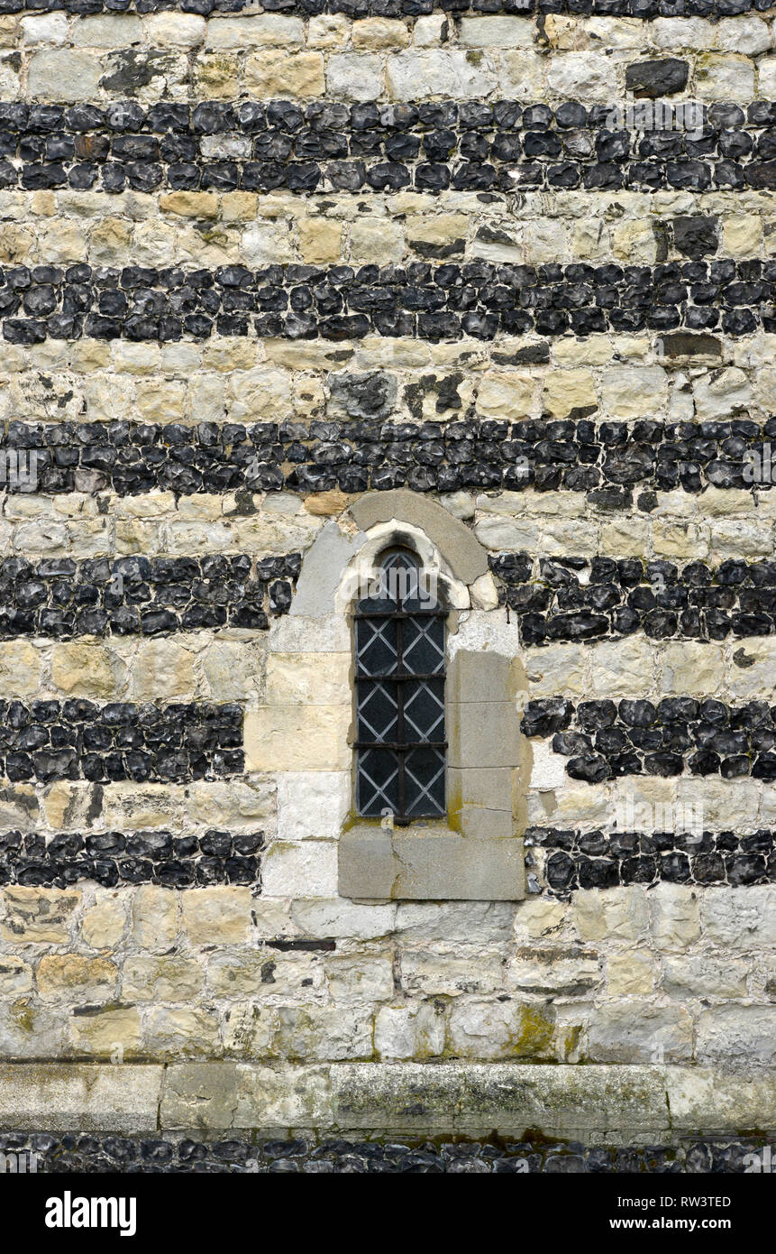 Flint and limestone stripes in St. Clement's Church West Thurrock Stock Photo