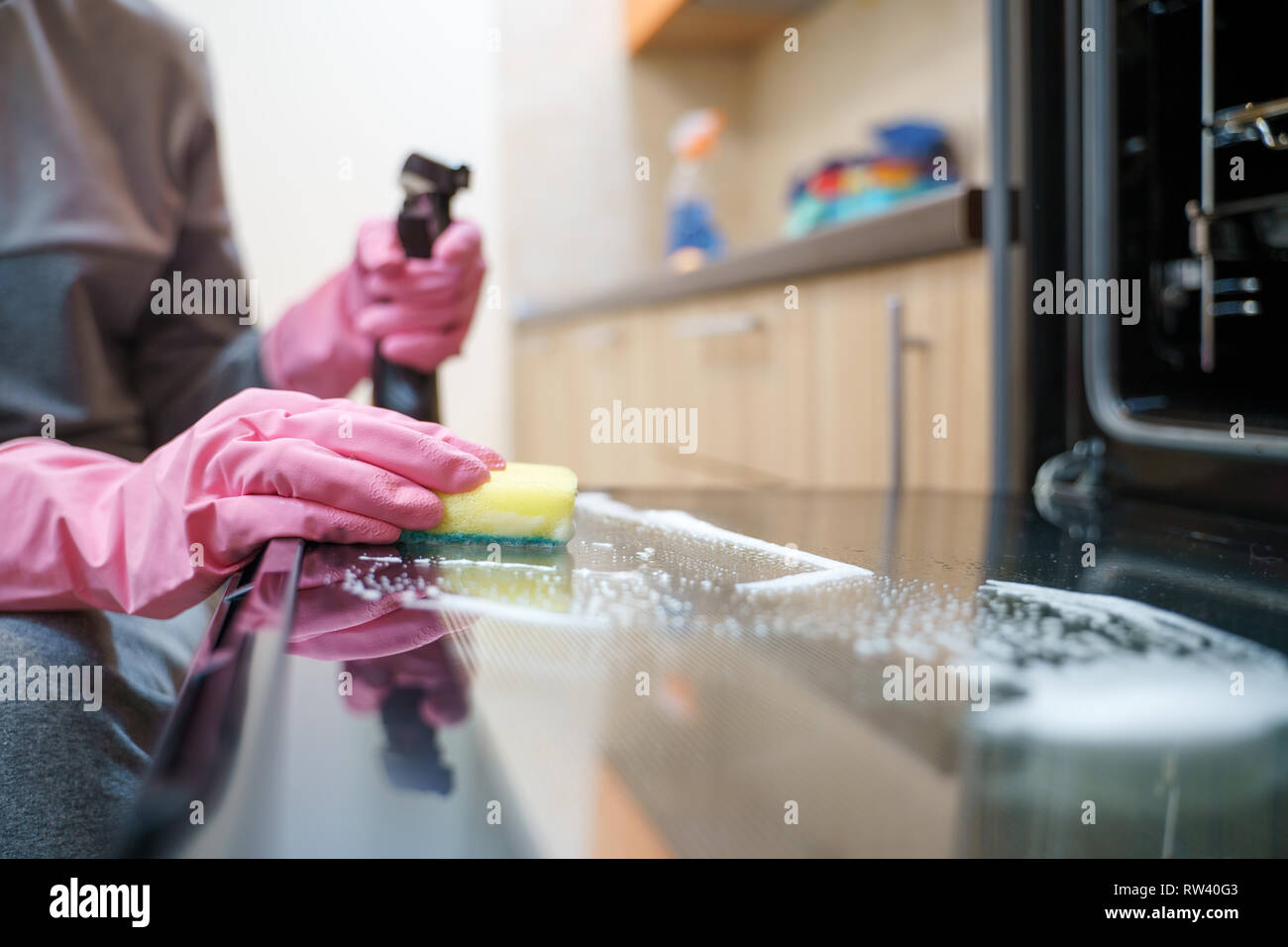 Image of woman's hands in rubber gloves washing oven Stock Photo Alamy