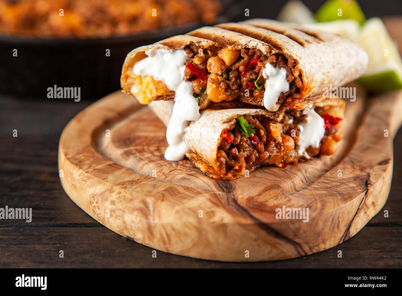 Mexican burrito with beef, beans and sour cream Stock Photo - Alamy