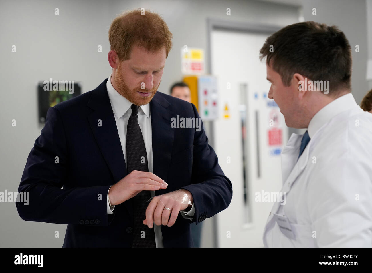 The Duke of Sussex tries out a dressing impregnated with Decorin protein to aid in scar healing, as he tours The Institute of Translational Medicine at Queen Elizabeth Hospital in Birmingham. Stock Photo