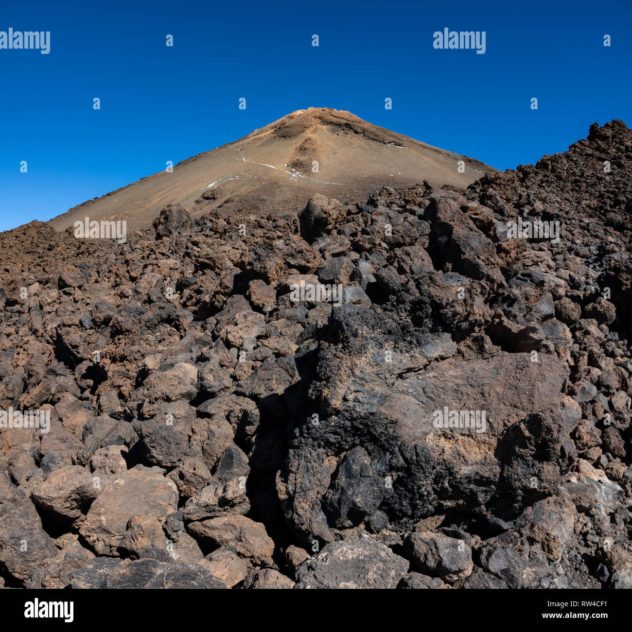 Teide volcano top crater and blue sky over the rock lava fields Stock Photo