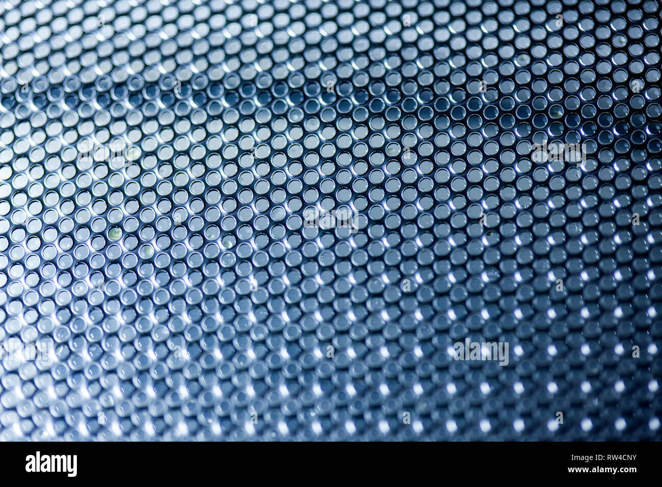 Hexagonal mesh on a blue background. Whole background. Stock Photo