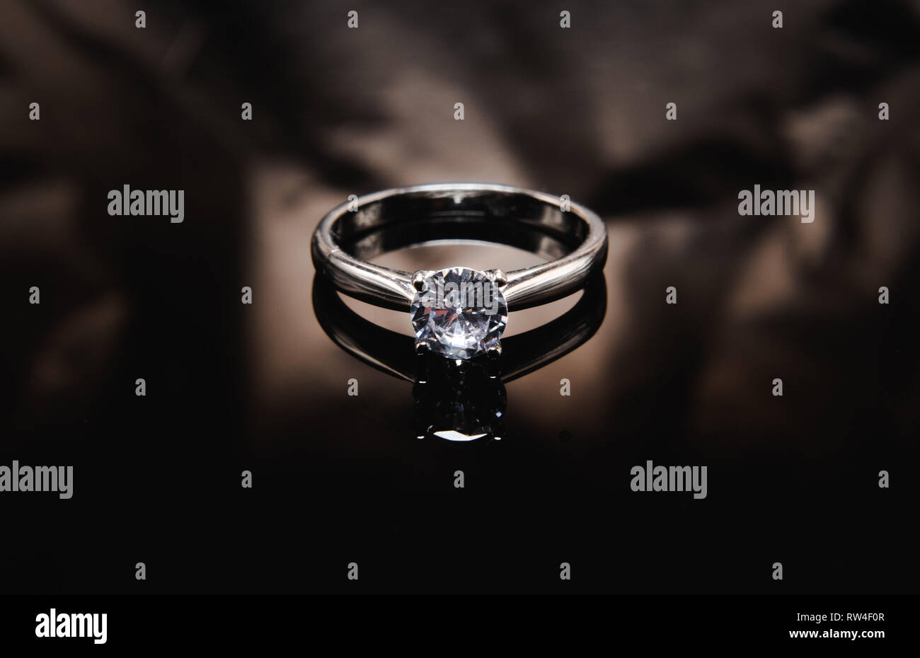 Ring on the black mirror surface Stock Photo