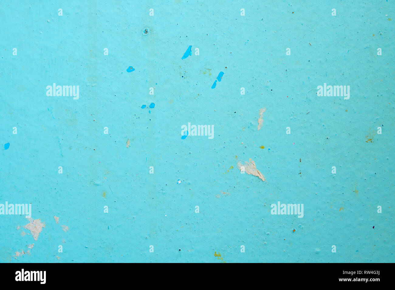 Peeling Blue Aquamarine Color Paint from the Wall. Shattered Plaster Background Stock Photo