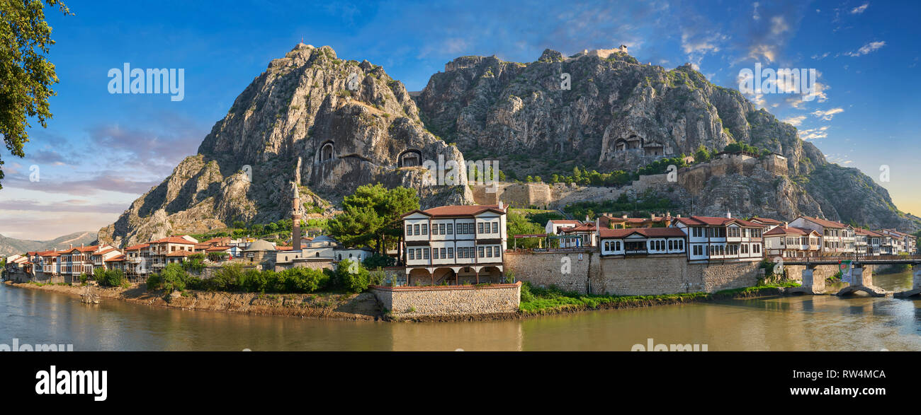 Ottoman villas of Amasya along the banks of the river Yeşilırmak, below the Pontic Royal rock tombs and mountain top ancient citadel at sunrise, Turke Stock Photo