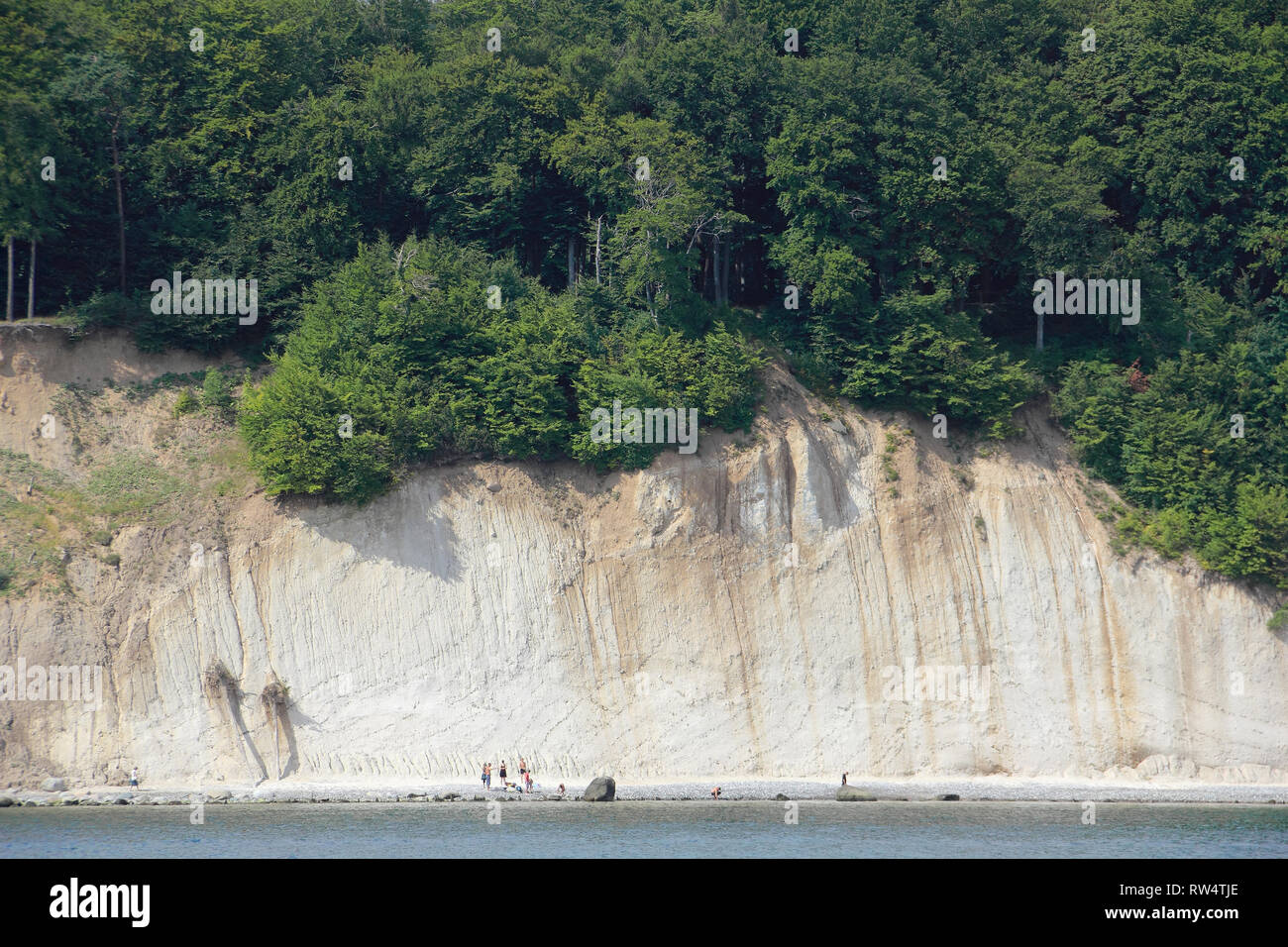 Cliff coast on the island of Rügen with hikers Stock Photo