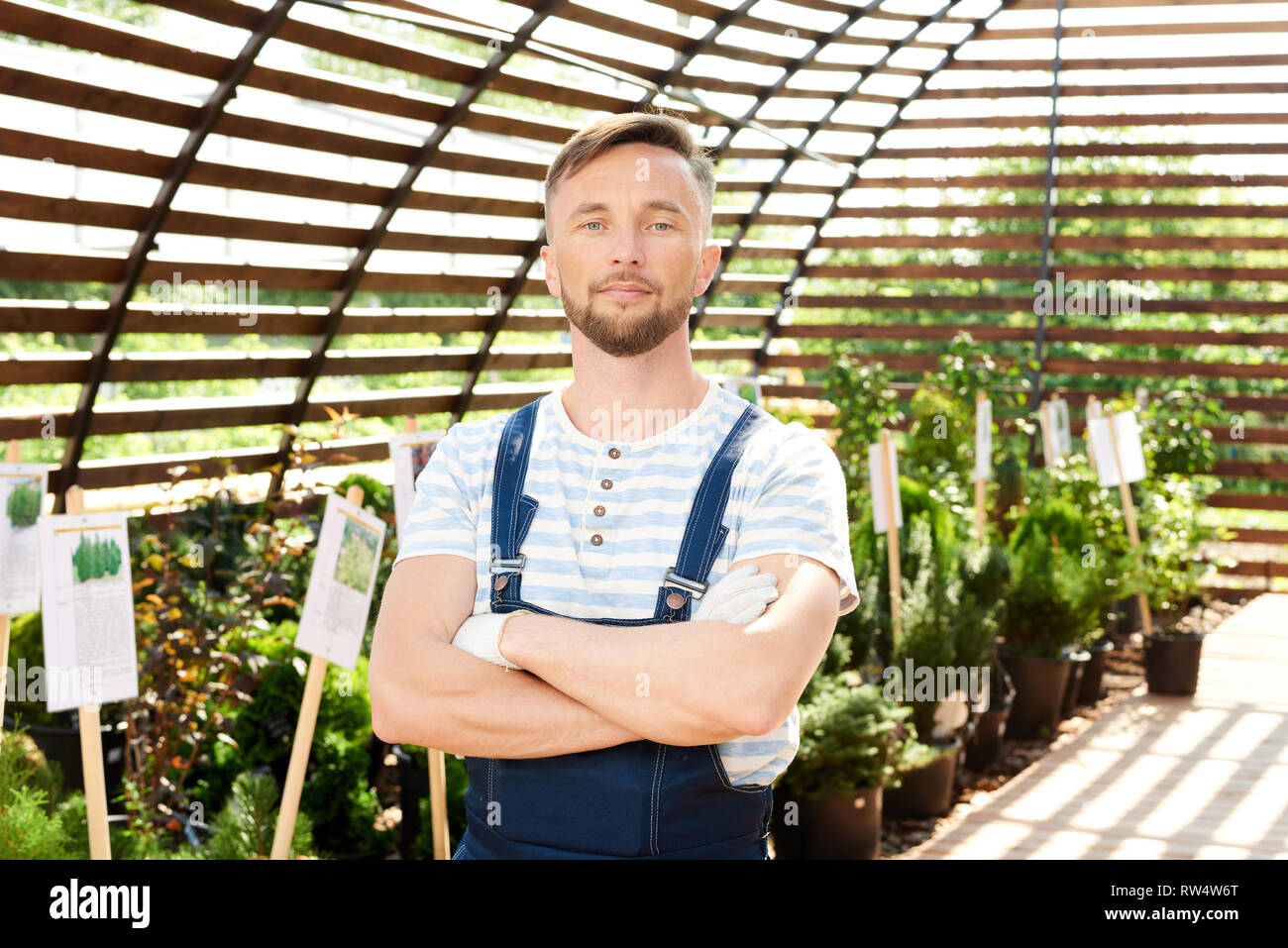 Handsome Worker in Garden Stock Photo