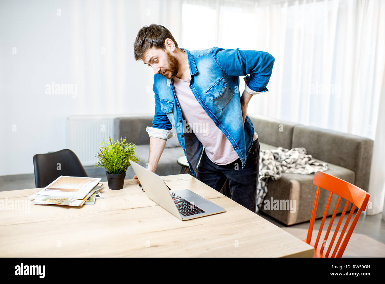 A Male Is Wearing An Orthopedic Posture Corrector Treatment For Stoop And  Back Problems Closeup The Guy Sits On A Chair In The Office Stock Photo -  Download Image Now - iStock