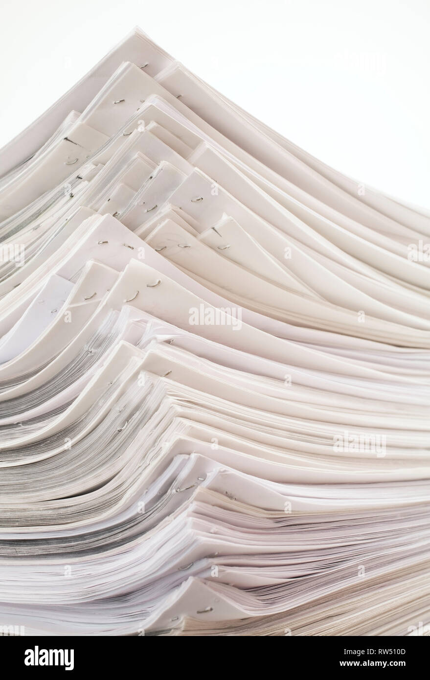 Stack Of Stapled White Sheets Of Office Paper On A White