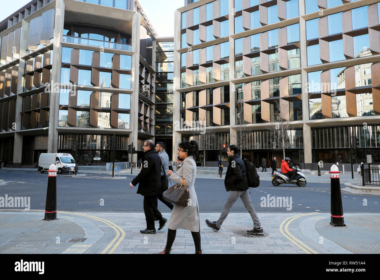 Exterior view of office workers walking near the Bloomberg Building offices on Queen Victoria Street in the City of London England UK    KATHY DEWITT Stock Photo