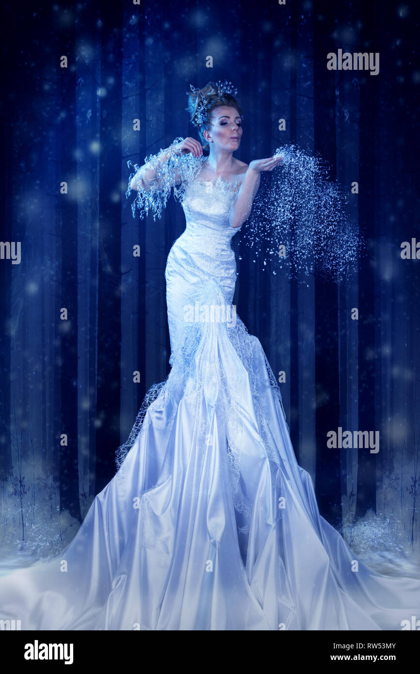 Snow Queen in the forest creates a blizzard Stock Photo