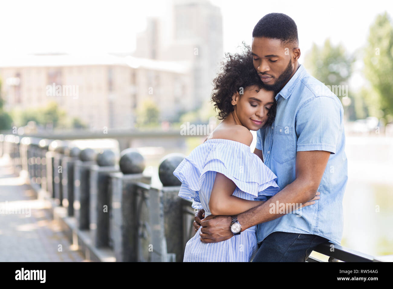 Loving young couple enjoying tender moment outdoors Stock Photo