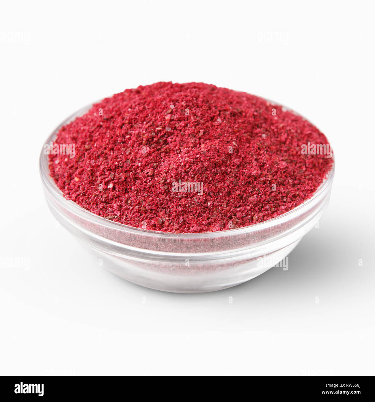 Heap of sumac powder spice isolated on white Stock Photo Alamy