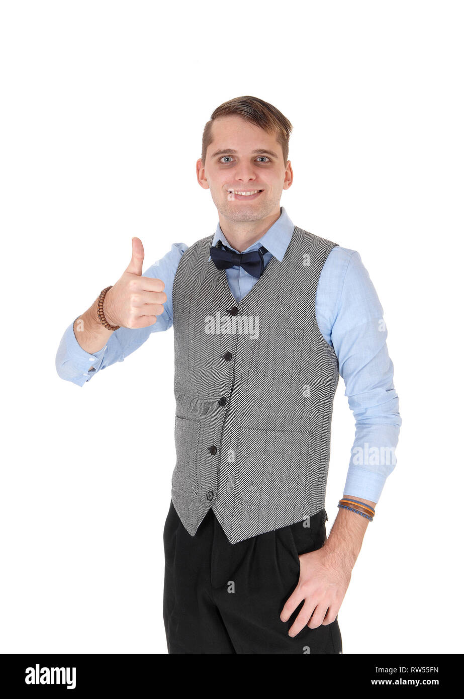 An image of a young happy businessman smiling and showing his thump  up agreeing with the dissension, isolated for white background Stock Photo