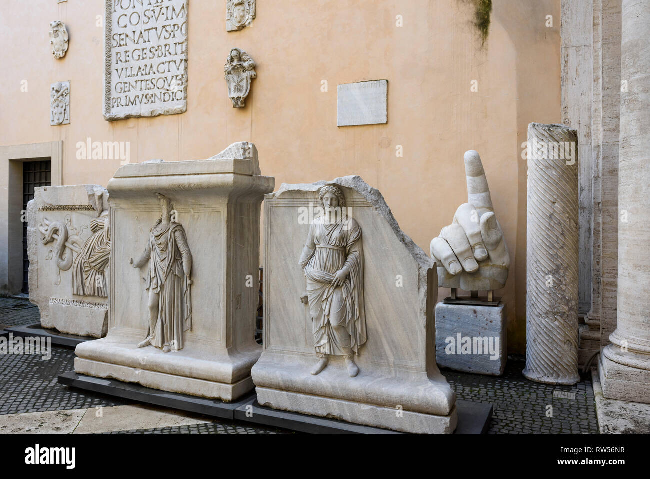 Rome. Italy. Reliefs with personifications of Provinces and trophies of arms in the courtyard of Palazzo dei Conservatori, from the Temple of Hadrian, Stock Photo