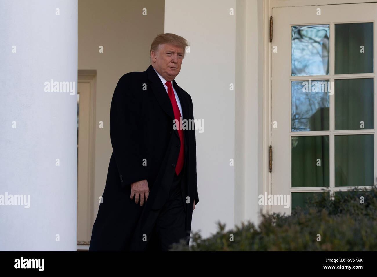 US President Donald Trump exits the Oval Office prior to speaking about the government shutdown on January 25, 2019, from the Rose Garden of the White House in Washington, DC. Stock Photo