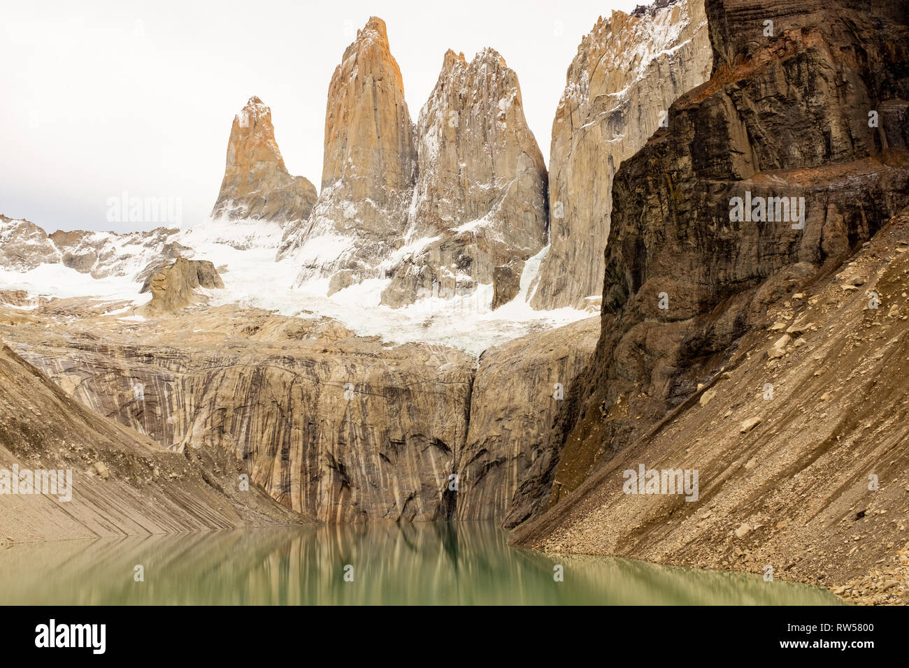 The incredible Laguna Torres, three granite peaks in Patagonia part of  Torres del Paine, National Park, Chile on an overcast and moody day  reflection Stock Photo - Alamy