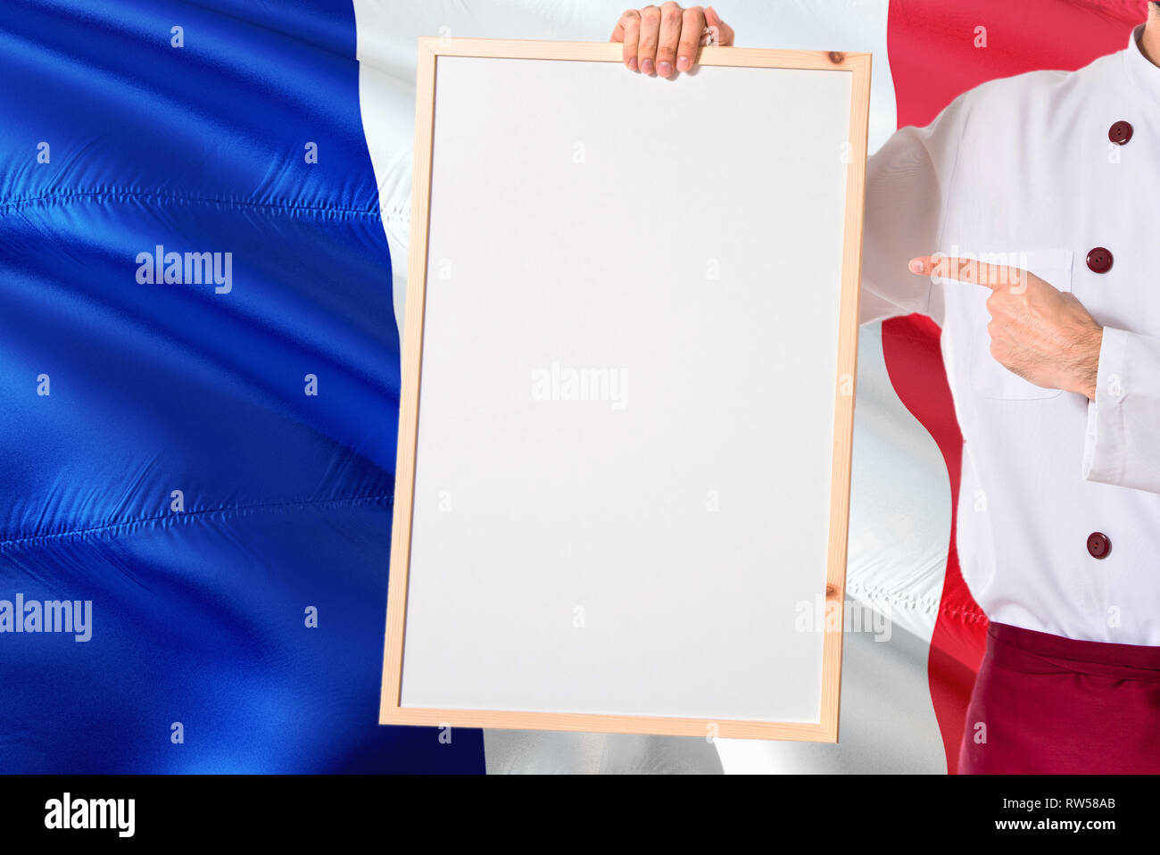 French Chef holding blank whiteboard menu on France flag background
