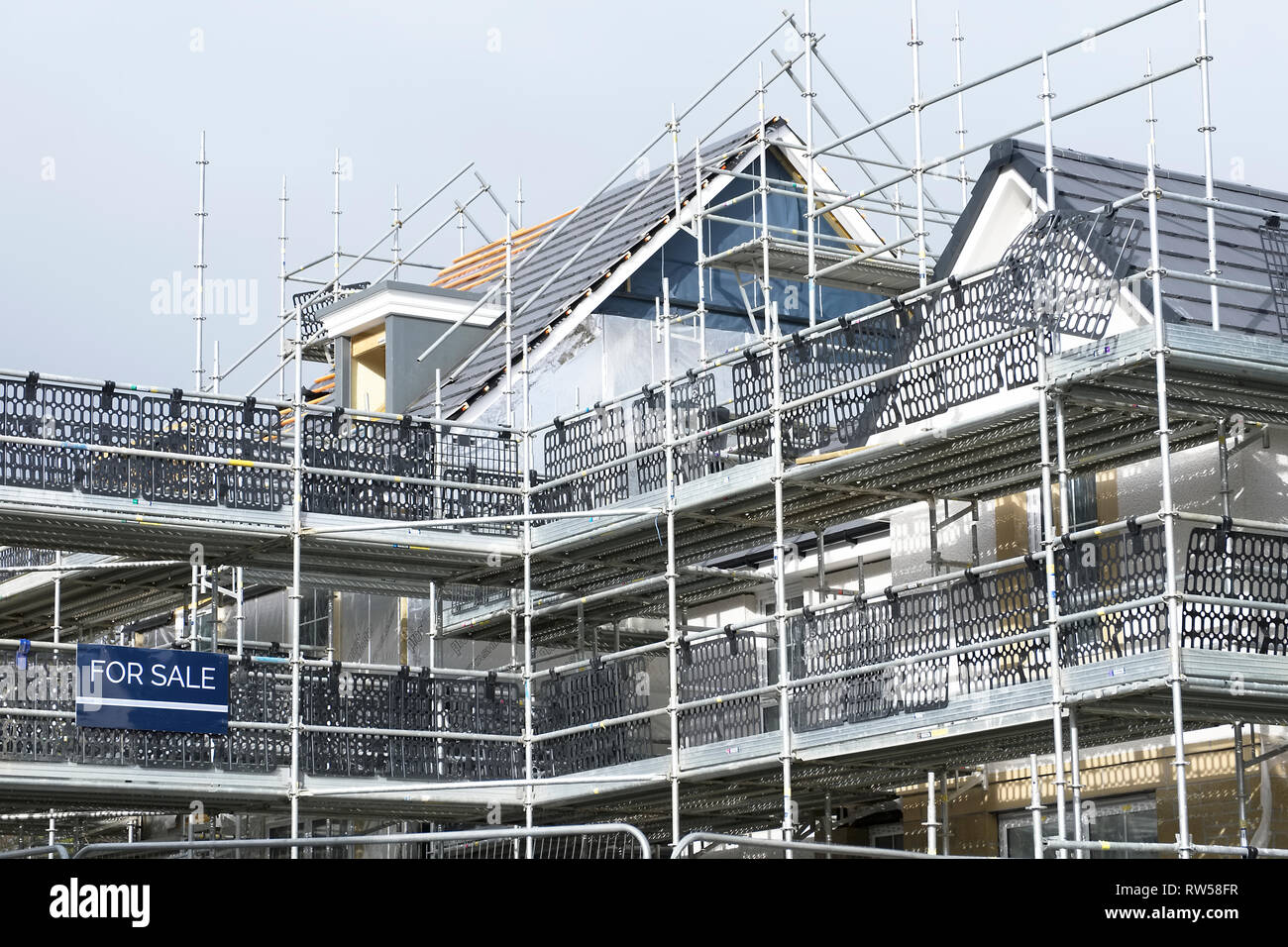 Scaffold at construction of new houses in residential building site ...