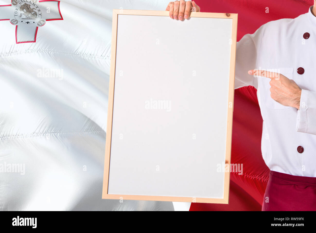 Maltese Chef holding blank whiteboard menu on Malta flag background