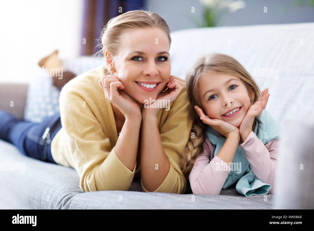 Beautiful mom and her daughter having fun at home Stock Photo Alamy