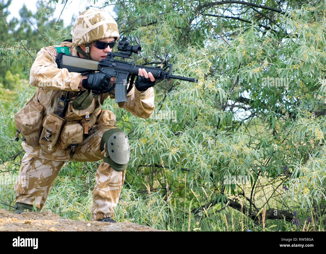 British soldier in camouflage uniform in action Stock Photo Alamy