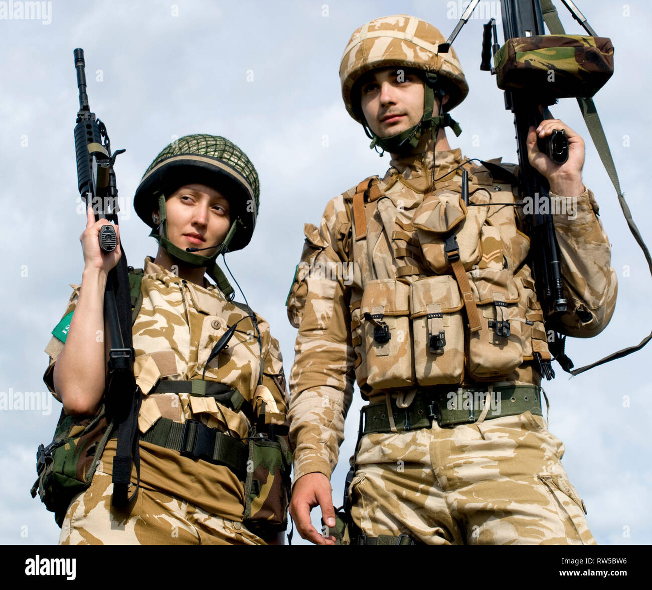 British Royal Commandos in desert uniform holding their rifles. Stock Photo