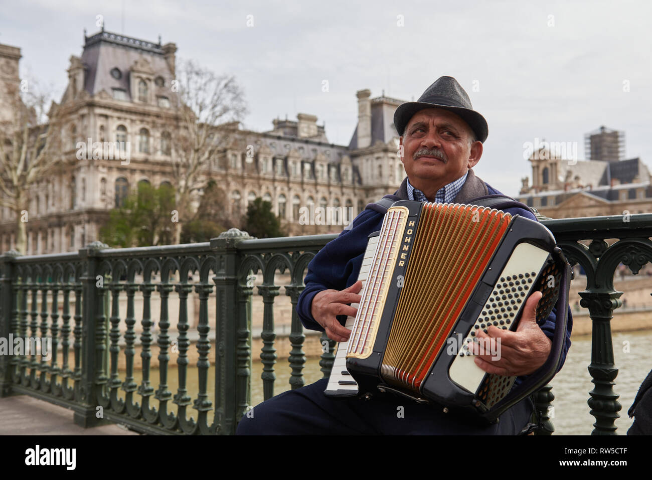 Close up portrait of the accordion player from Notre Dame, Paris. Stock Photo