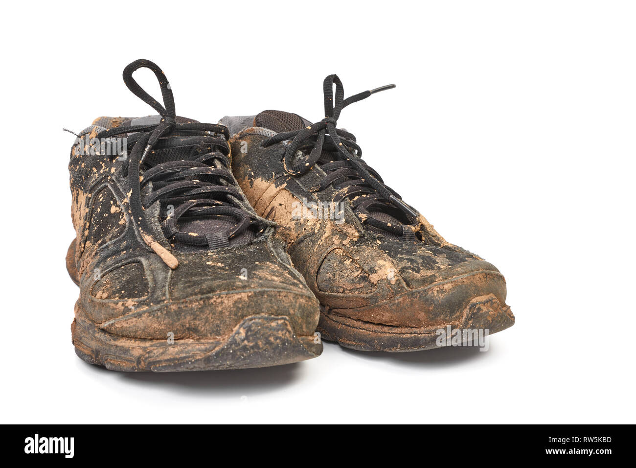 Dirty shoes full of mud Stock Photo - Alamy