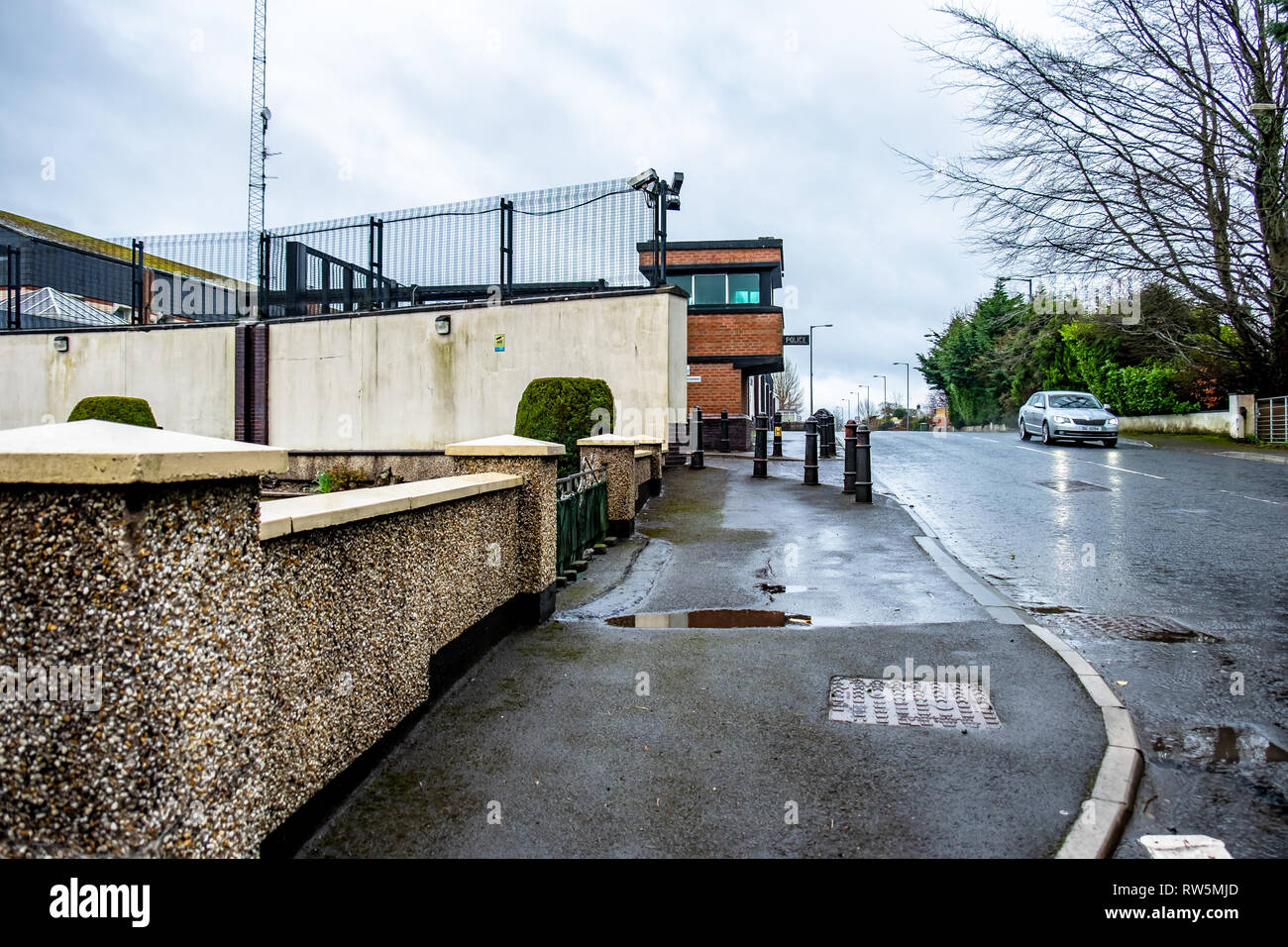 ENNISKILLEN, ULSTER / NORTHERN IRELAND - MARCH 03 2019 : The Kesh police station is protected by a huge fence a couple of days before the Brexit. Stock Photo