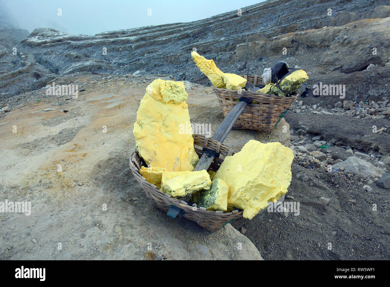Sulfur miner at Kawah Ijen volcano crater in Java, Indonesia Stock ...