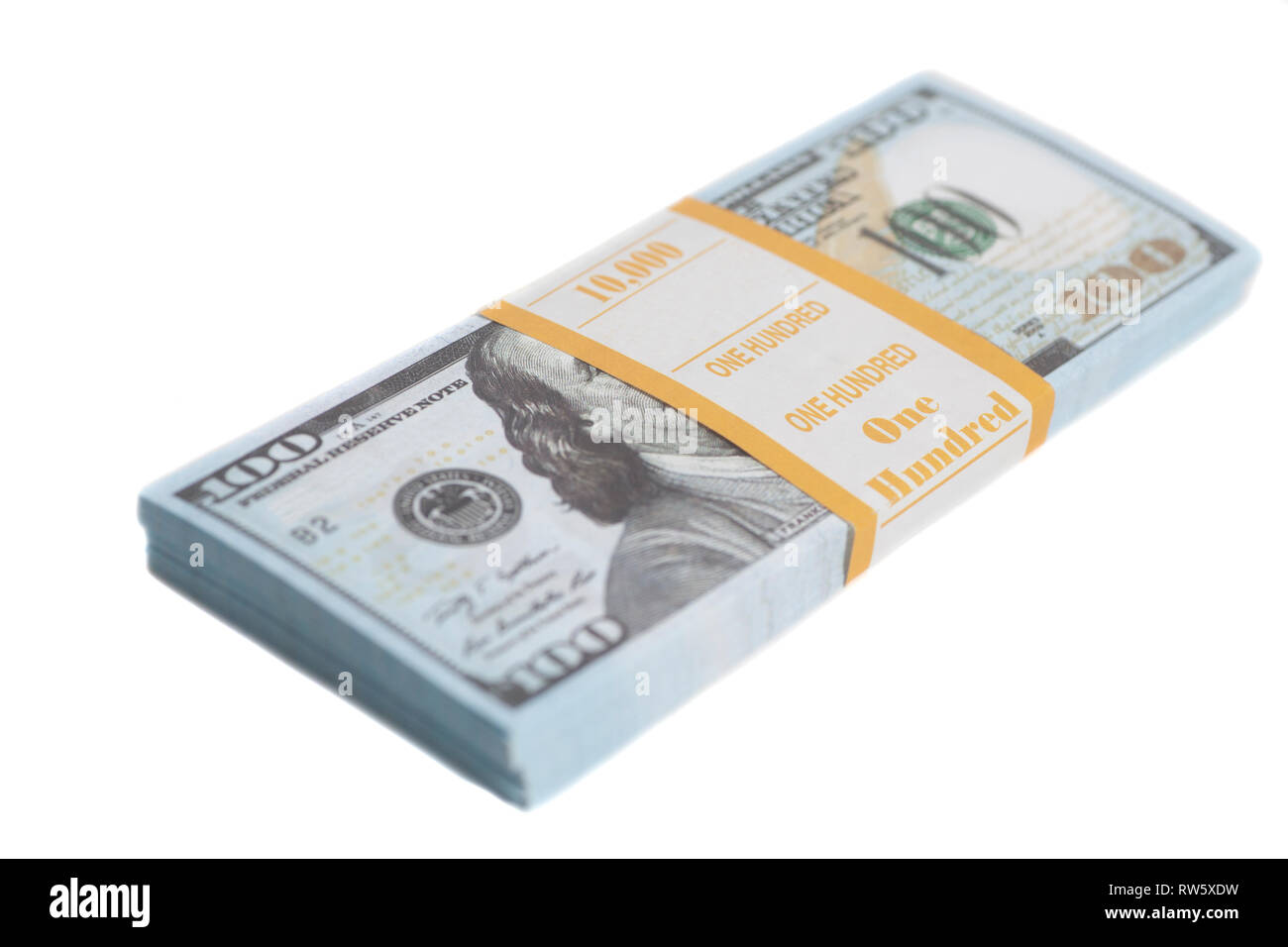 Stack one hundred dollars bills with tape isolated on white background