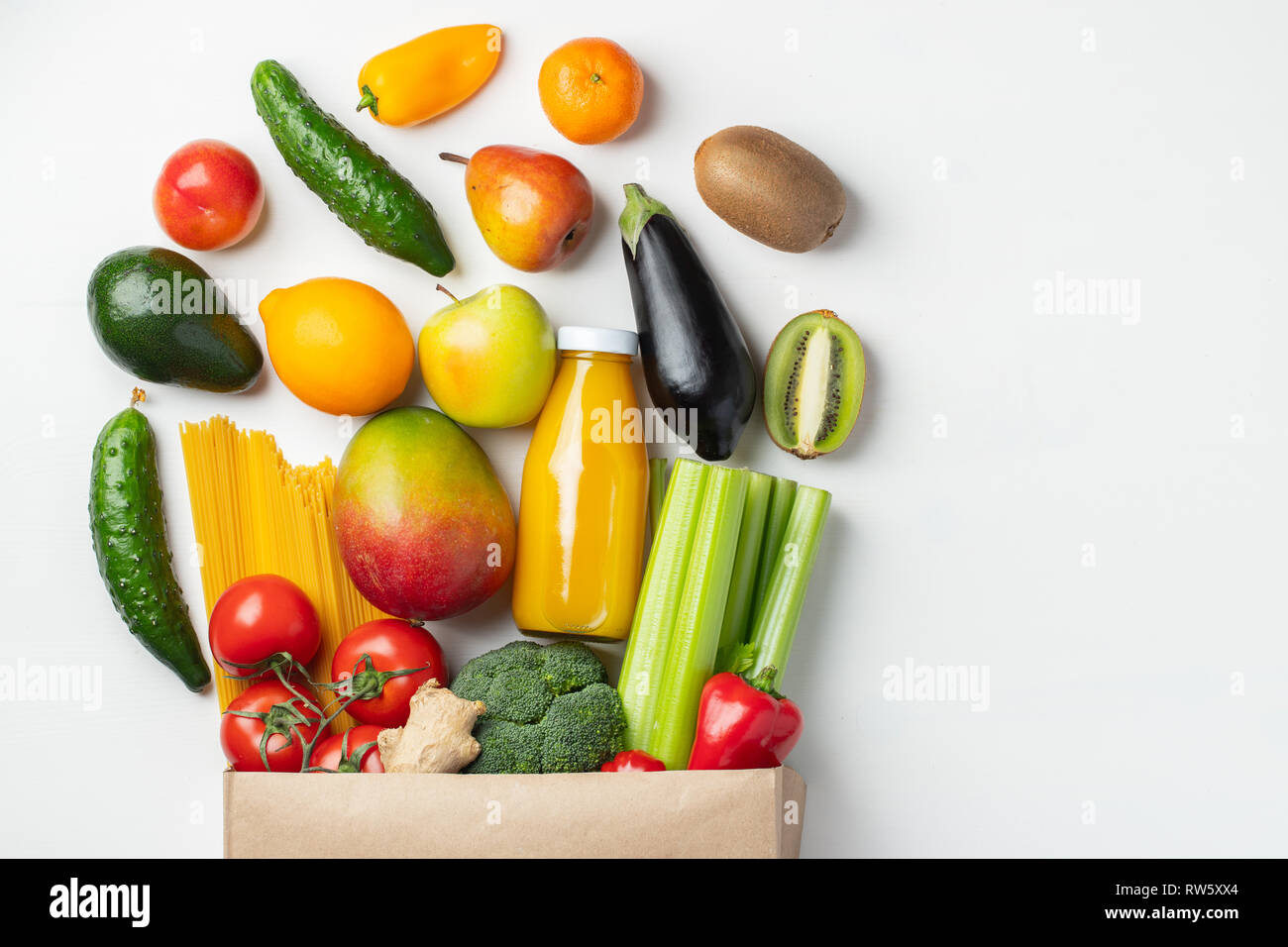 Paper bag of different health food on a white background. Top view ...