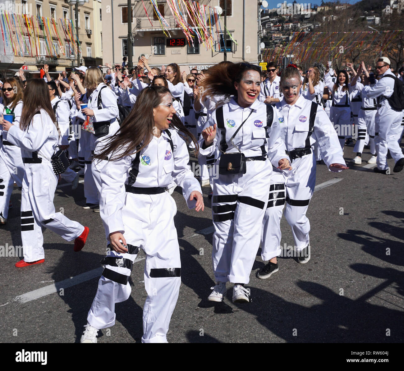 Rijeka, Croatia, March 3rd, 2019. Happy and smiling group of Millenials dancing on carnival procession Stock Photo